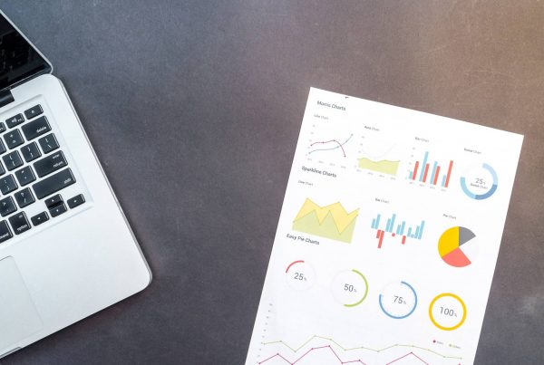 Paper beside Macbook useful features Excel